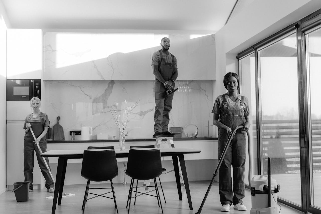 services-01 A team of professional cleaners working in a modern dining room setting, enhancing interior cleanliness.